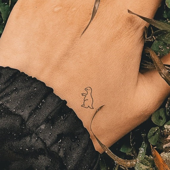 Petit tatouage T Rex