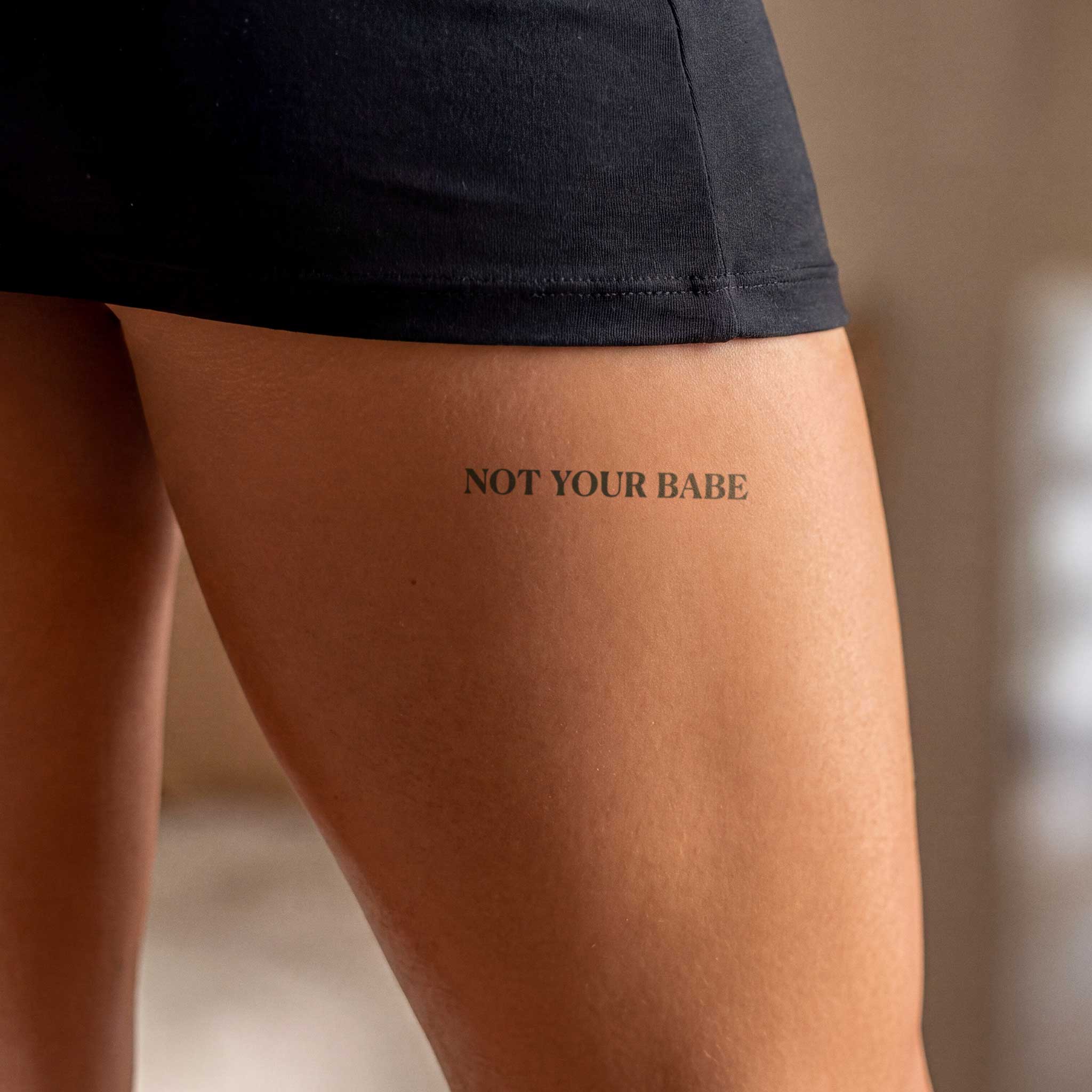 Tatouage "Not your babe"