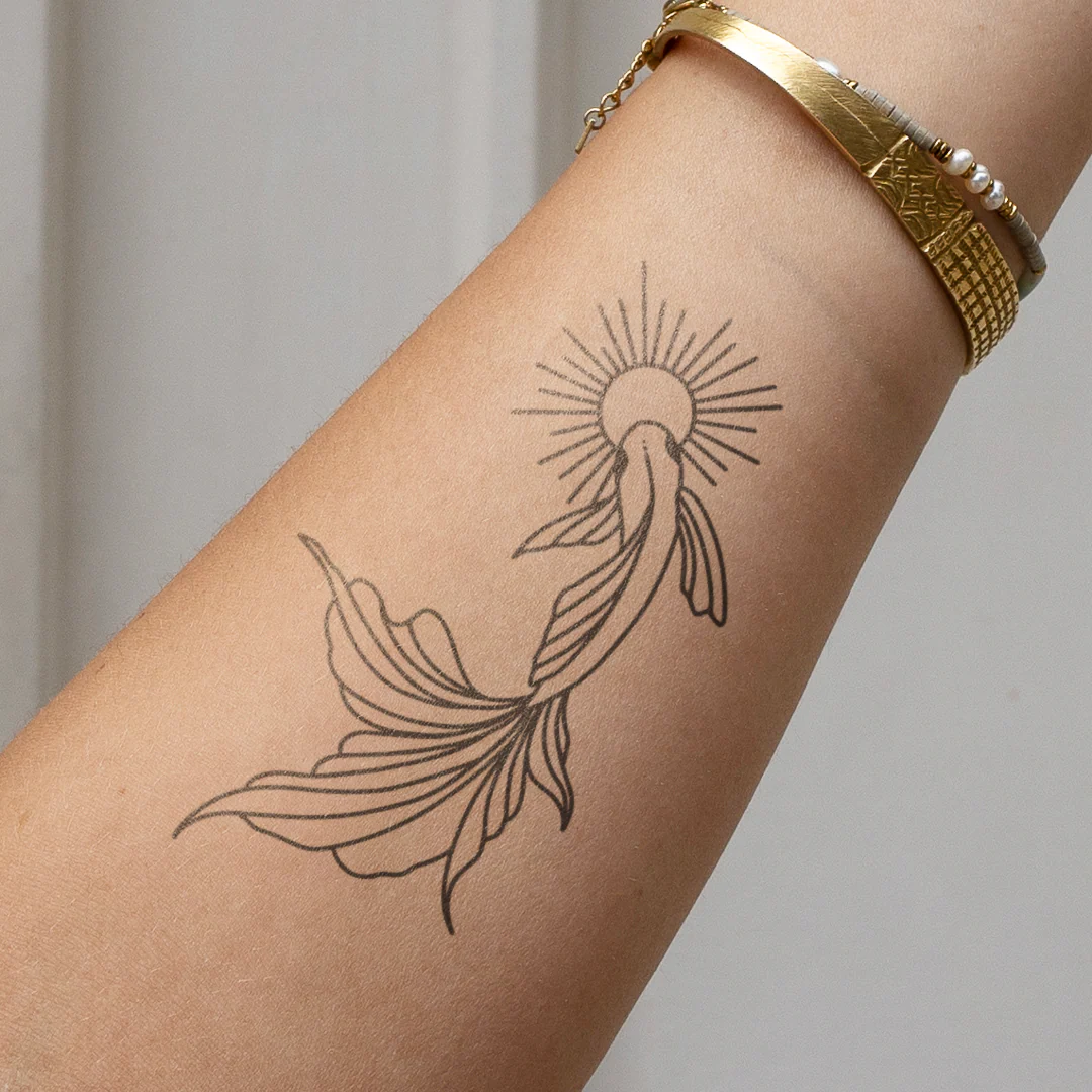 Tatouage Poisson rouge et soleil