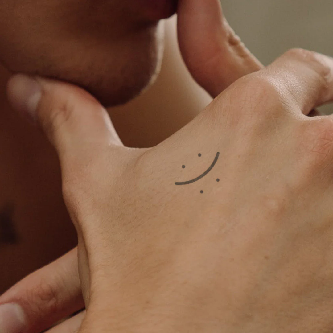 Tatouage Smiley à deux visages